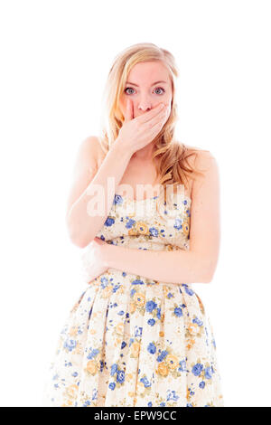 Beautiful young woman looking shocked Stock Photo