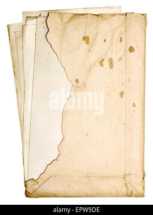 stack of old papers in a torn envelope isolated on white background Stock Photo