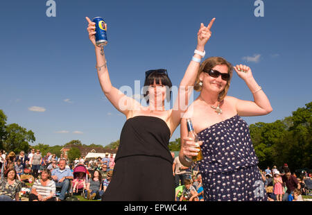 Women enjoying themselves at a local music festival (CHIDDFEST 2015),  Chiddingfold, Godalming, Surrey, UK Stock Photo