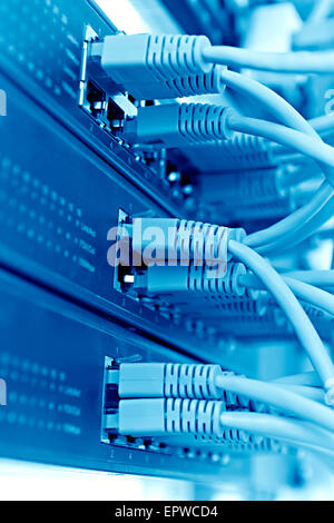 Patch Panel server rack with  cords in the background, blue tone Stock Photo
