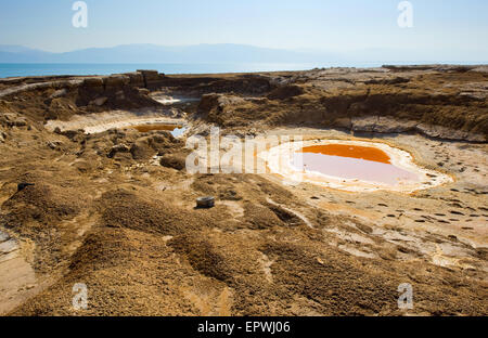 Sinkhole or open pit on the shore's of the dead sea at the end of the summer when the water level is at it's lowest