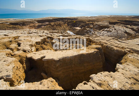 Sinkholes or open pit on the shore's of the dead sea at the end of the summer when the water level is at it's lowest