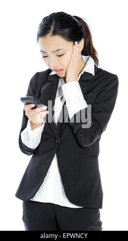 Attractive asian girl in her twenties isolated on a plein background shot in a studio Stock Photo