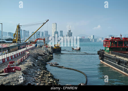 dh Construction WAN CHAI HONG KONG Crane barges reclaimed land Stock Photo