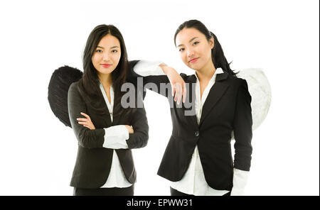 Attractive Asian young adult woman in angels and demon Stock Photo