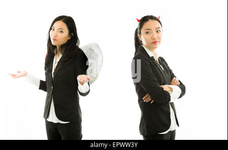 Attractive Asian young adult woman in angels and demon Stock Photo