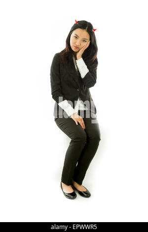 Attractive Asian young adult woman in angels and demon Stock Photo