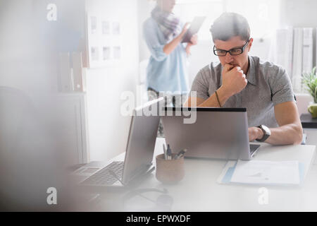 Man and woman working in office Stock Photo