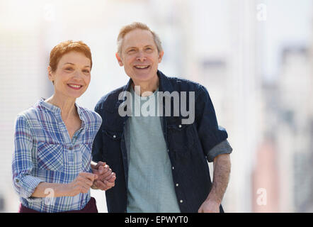 Outdoor portrait of smiling senior couple Stock Photo