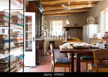Farm style kitchen with beamed ceiling in  South African home Stock Photo