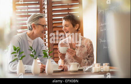 Senior couple talking at restaurant Stock Photo