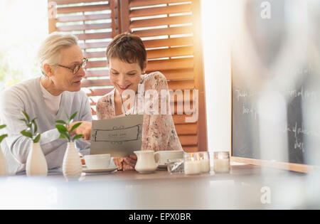 Senior couple looking at menu Stock Photo