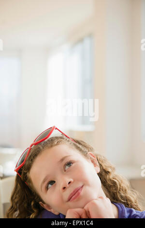 Portrait of girl (10-11) looking up Stock Photo