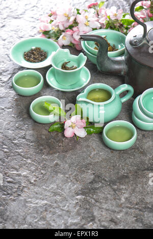 Teapot and cups on stone table. Traditional chinese tea ceremony. Asia style stil life Stock Photo