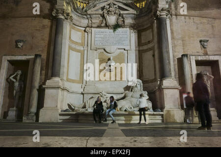 ROME, ITALY - MAY 16, 2015: people at the fountain of Marphurius one of the ancient Roman 'talking statues' on the Capitoline Hi Stock Photo