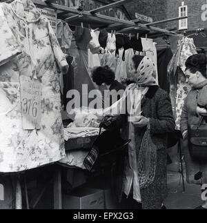 1950s, historical, outdoor market stall selling ladies cloth and