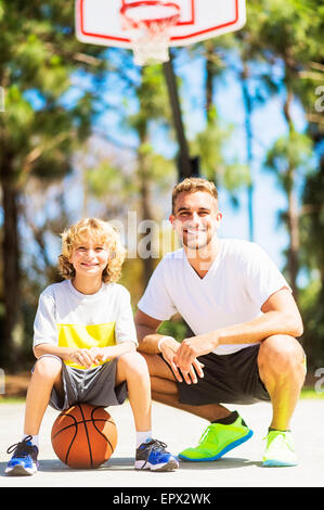 Portrait of man with his younger brother (8-9) Stock Photo