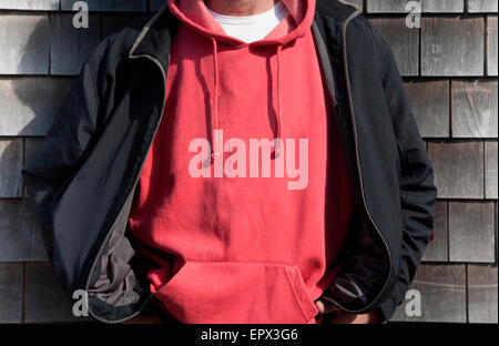 Man wearing red hooded shirt Stock Photo
