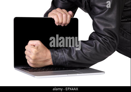Computer thief robber in leather jacket breaking laptop on white background Stock Photo