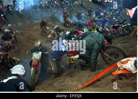 Motorcycle riders are pictured in total chaos as they try to get around the course at the annual Weston-Super-Mare Beach Race, which takes place in England, riders from all over the world converge on Weston, to compete in this 500 strong event. Stock Photo