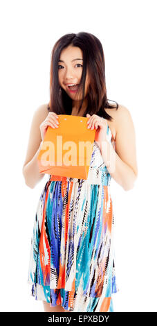 Attractive asian girl in her twenties isolated on a plein background shot in a studio Stock Photo