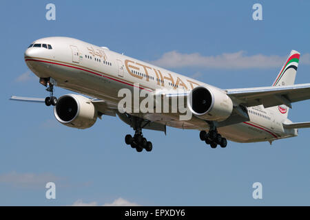 Boeing 777-300ER long-haul widebody airliner belonging to Abu Dhabi airline Etihad on approach. Close-up front view. Stock Photo