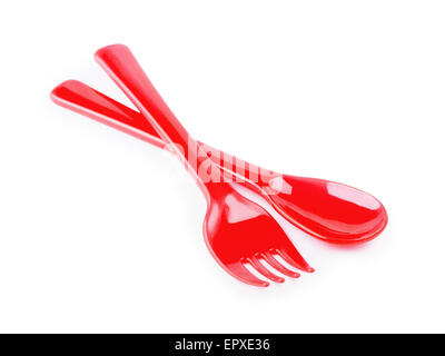 Red plastic knife fork on a white background Stock Photo