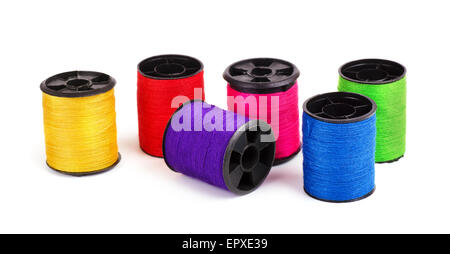 Various thread spools on a white background Stock Photo