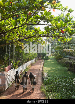 Female students walk to school in Southern India. Kerela, India. Stock Photo