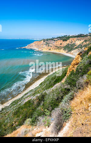 A beautiful ocean image along the cliffs in Palos Verdes California shows a remote cove and bright, sunny day. Stock Photo