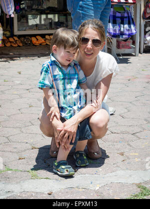 Woman with her son in a market Stock Photo