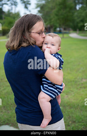 Mother kisses her infant son Stock Photo
