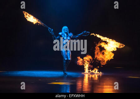 Belfast, Northern Ireland. 22 May 2015 - A woman shoots flames from arm-mounted flame throwers as part of Clarkson, Hammond and May Live tour. Stock Photo