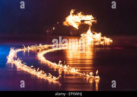 Belfast, Northern Ireland. 22 May 2015 - A Porsche 911 leaves flaming tyre tracks after being set on fire during Clarkson, Hammond and May Live Credit:  Stephen Barnes/Alamy Live News Stock Photo