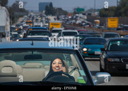 LOS ANGELES, CA – MAY 18: Moslem woman driving automobile on the freeway in Los Angeles California, U.S. on May 18, 2007. Stock Photo