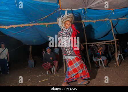 A man in traditional attire dancing during a traditional community gathering in Maubesi village, Rote Island, East Nusa Tenggara, Indonesia. Stock Photo