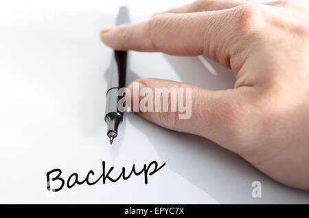 Pen in the hand isolated over white background Backup concept Stock Photo