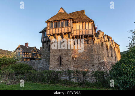Stokesay Castle and gatehouse near Ludlow in Shropshire with the late evening sun setting.
