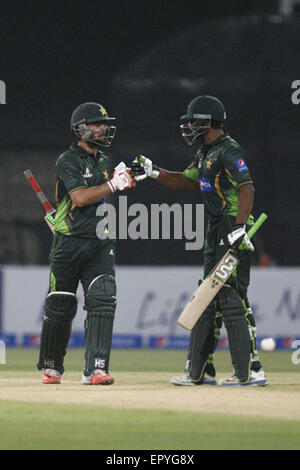 Lahore, Pakistan. 22nd May, 2015. Pakistani and Zimbabwe cricket players take a part of the 1st International T20 cricket match at the Gaddafi Cricket Stadium where Pakistani team won. Pakistan cricket lovers were ecstatic on the resumption of the international cricket after a hiatus of six years amid tight security. Thousands of fans carrying Pakistani flags waited for hours before entering the Qaddafi Stadium. State-run PTV Sports reported about 30,000 spectators were inside the stadium to watch the contest. Credit:  Rana Sajid Hussain/Pacific Press/Alamy Live News Stock Photo