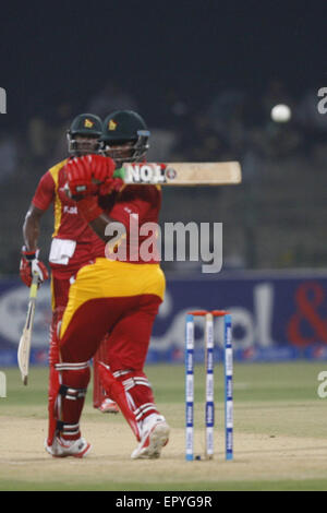 Lahore, Pakistan. 22nd May, 2015. Pakistani and Zimbabwe cricket players take a part of the 1st International T20 cricket match at the Gaddafi Cricket Stadium where Pakistani team won. Pakistan cricket lovers were ecstatic on the resumption of the international cricket after a hiatus of six years amid tight security. Thousands of fans carrying Pakistani flags waited for hours before entering the Qaddafi Stadium. State-run PTV Sports reported about 30,000 spectators were inside the stadium to watch the contest. Credit:  Rana Sajid Hussain/Pacific Press/Alamy Live News Stock Photo