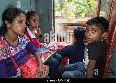Family Traveling on Busy Train, Colombo Fort Station, Sri Lanka Stock Photo