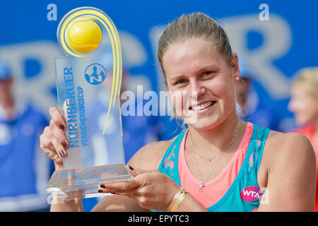 Nuremberg, Germany. 23rd May, 2015. Karin Knapp of Italy holds up her trophy as she celebrates her victory against Roberta Vinci of Italy in the final of the WTA tennis tournament in Nuremberg, Germany, 23 May 2015. PHOTO: DANIEL KARMANN/dpa/Alamy Live News Stock Photo
