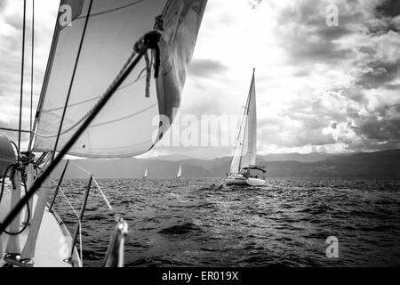 Sailing yachts in the sea in stormy weather. Black and white photo. Stock Photo