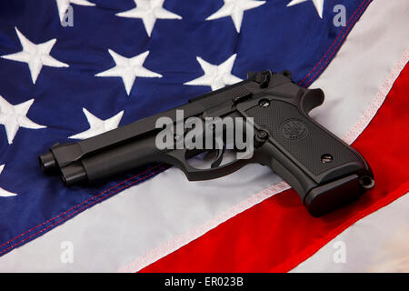 beretta handgun lying on united states of america flag Stock Photo