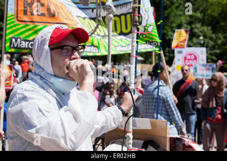 Saturday, May 23, 2015, Washington, DC USA:  Hundreds of food safety activists marched from the White House to Monsanto's  Washington office chanting and protesting against GMOs and pesticides, as part of an international revolt against Monsanto.  Monsanto employees responded by holding  up signs and talking with the press. Stock Photo