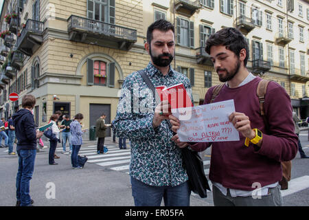 Turin, Italy. 23rd May, 2015. Two gay men trying to enforce their rights in the midst of the Standing Sentinels. Credit:  Elena Aquila/Pacific Press/Alamy Live News Stock Photo