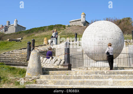 Tourists discussing the Great Globe, Durlston Country Park, Swanage, Dorset, England. Stock Photo