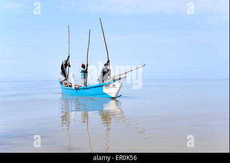 Fishers at Lake Victoria usually pushing forward in the lower water with a long stick Stock Photo