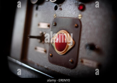 Red bottom of alarm system at the control room of the basement cells at the former KGB prison now the museum of Genocide Victims in the city of Vilnius capital of Lithuania Stock Photo