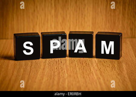 spam e-mail text on black block Stock Photo